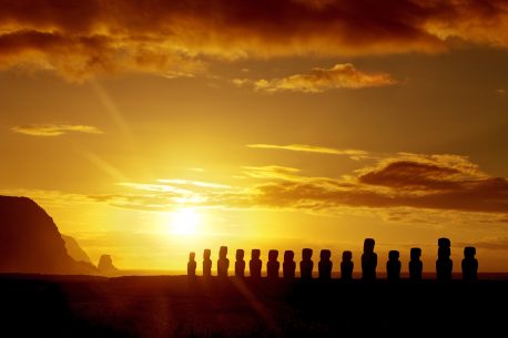 Mysterious stone statues at sunrise in Easter Island